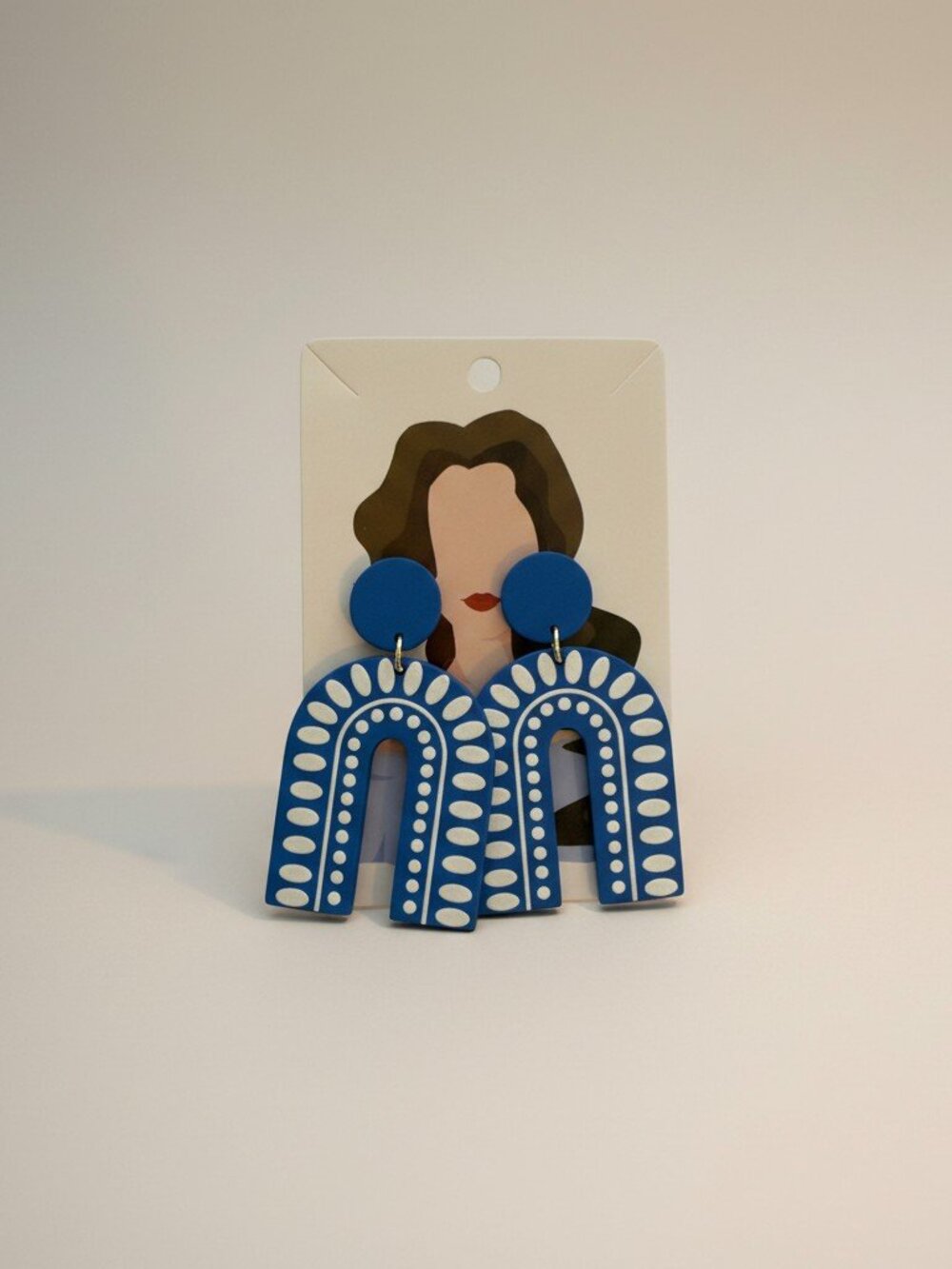 Blue patterned earrings — storage pouch included as a gift